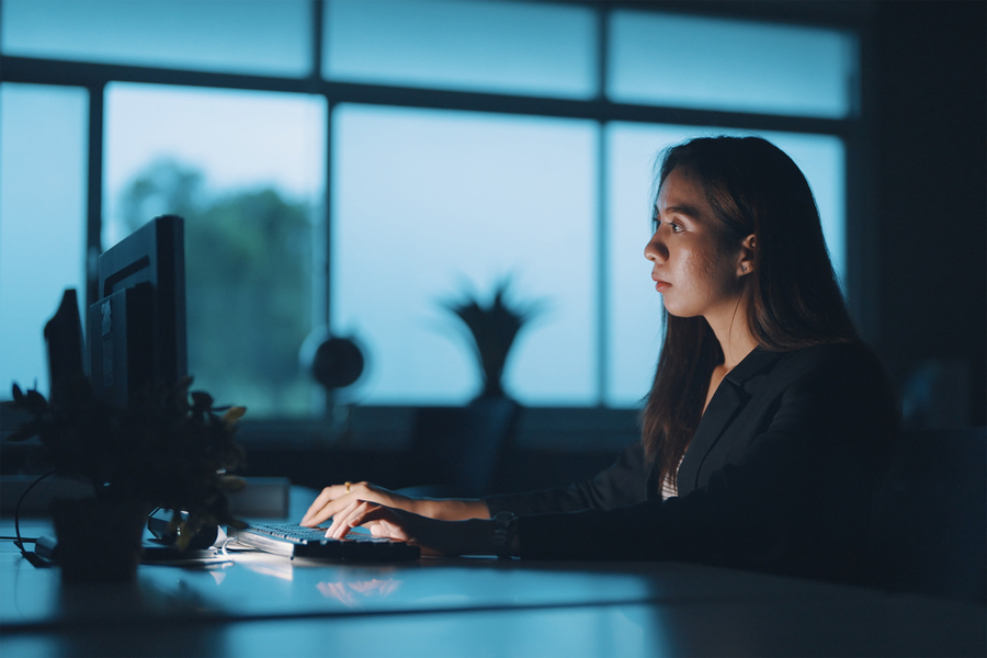 woman typing at a computer 