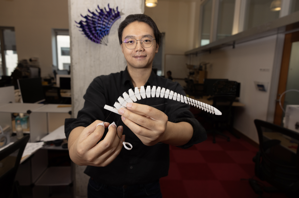 The “Xstrings” method can produce a range of colorful and unique objects, like a white tentacle that curls around items and a purple wall sculpture that can open and close (Credit: Mike Grimmett/MIT CSAIL).