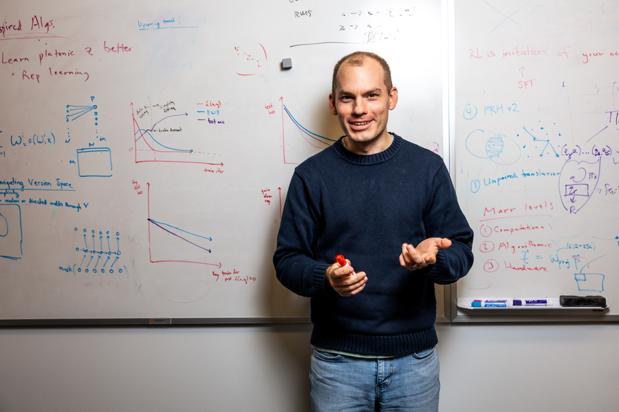 alt="MIT associate professor Phillip Isola (Credits: Jake Belcher)."