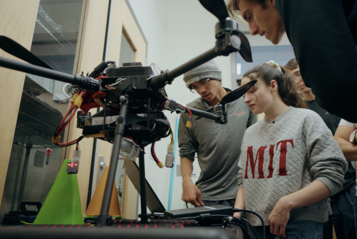 alt="In class 16.85 Autonomy Capstone (Design and Testing of Autonomous Vehicles), MIT students design, implement, deploy, and test a full software architecture for flying autonomous systems (Credits: Lillie Paquette/In Short Media)."