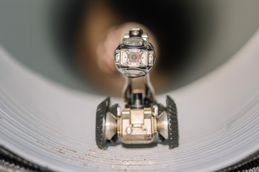 A new chip developed by MIT researchers could help tiny, low-power robots avoid obstacles as they navigate around tight corners inside an industrial HVAC system to check for gas leaks (Credits: iStock).